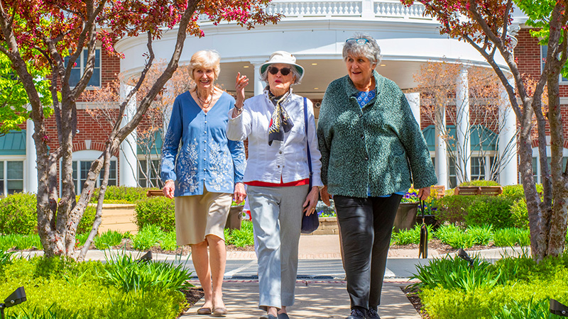 Outdoor photo of three women walking